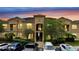 Exterior of building with a parking lot and landscaping at 505 Terrace Ridge Cir # 505, Davenport, FL 33896