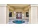 A round hot tub under a covered portico provides residents with a relaxing spa experience at 505 Terrace Ridge Cir # 505, Davenport, FL 33896