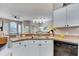 Well-lit kitchen showcasing a view of the living and dining area through a pass-through at 505 Terrace Ridge Cir # 505, Davenport, FL 33896