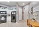 Efficient kitchen featuring modern appliances, white cabinets, and easy access to entryways at 505 Terrace Ridge Cir # 505, Davenport, FL 33896