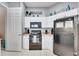 Efficient kitchen featuring black appliances and white cabinetry at 505 Terrace Ridge Cir # 505, Davenport, FL 33896