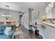 Open-concept living room with hardwood floors, breakfast bar, and modern decor at 505 Terrace Ridge Cir # 505, Davenport, FL 33896
