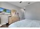 Cozy main bedroom with a dresser, TV, and closet space at 505 Terrace Ridge Cir # 505, Davenport, FL 33896