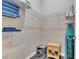 Walk-in closet with built-in metal shelving, safe, ironing board and storage at 505 Terrace Ridge Cir # 505, Davenport, FL 33896