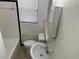 Standard bathroom with tiled walls, a window, and neutral fixtures at 520 Ruffel St, Maitland, FL 32751