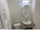 Bright half bathroom with white fixtures and a clean, functional design at 520 Ruffel St, Maitland, FL 32751