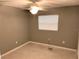 Cozy bedroom with neutral paint, carpet, ceiling fan, and natural light from a window at 520 Ruffel St, Maitland, FL 32751