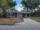 Charming single-story home with a covered carport and well-maintained front yard in a sunny neighborhood at 520 Ruffel St, Maitland, FL 32751