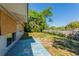Landscaped backyard with mature trees, fenced perimeter, and concrete patio slab offering serene outdoor living at 5201 Palisades Dr, Orlando, FL 32808