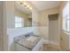 Bathroom with granite counter, white cabinets, and a shower-tub is both functional and stylish at 5201 Palisades Dr, Orlando, FL 32808