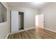This is a bedroom with a closet, hardwood floors, and a window at 5201 Palisades Dr, Orlando, FL 32808