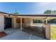 A view of the carport area of the house, displaying its architectural design and functionality for parking at 5201 Palisades Dr, Orlando, FL 32808