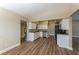 Partial view of the kitchen and adjacent utility room with a water heater at 5201 Palisades Dr, Orlando, FL 32808