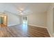 Bright living room with wood flooring, ceiling fan, and sliding glass door to the outside at 5201 Palisades Dr, Orlando, FL 32808