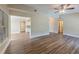 An open-concept living space with laminate flooring and natural lighting, showcasing an inviting and versatile area at 5201 Palisades Dr, Orlando, FL 32808