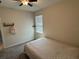 Bedroom features a ceiling fan, neutral paint, carpeted floor, and a window at 5550 Bakewell Pl, St Cloud, FL 34771