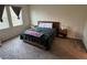 Cozy bedroom with a comfortable bed, wooden headboard, and matching nightstands at 5550 Bakewell Pl, St Cloud, FL 34771