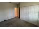 Carpeted bedroom with closet space and attached bathroom at 5550 Bakewell Pl, St Cloud, FL 34771