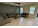 Comfortable living room with tile flooring and ample natural light at 5550 Bakewell Pl, St Cloud, FL 34771