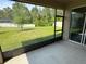 View of the fenced backyard from the screened lanai at 5550 Bakewell Pl, St Cloud, FL 34771