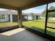 View from screened lanai showcasing the spacious backyard at 5550 Bakewell Pl, St Cloud, FL 34771