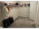 Spacious walk-in closet offers ample storage with shelving and a hanging rack at 5550 Bakewell Pl, St Cloud, FL 34771