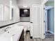 Updated bathroom featuring modern vanity and wood-look tile flooring at 6021 Windhover Dr # F11, Orlando, FL 32819