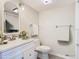 Bathroom features a stylish vanity, modern fixtures, and ample lighting at 6021 Windhover Dr # F11, Orlando, FL 32819