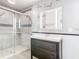 Bathroom showcasing a modern vanity, walk-in shower with decorative tile, and updated fixtures at 6021 Windhover Dr # F11, Orlando, FL 32819