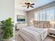 Comfortable bedroom featuring a ceiling fan, neutral tones, and natural light at 6021 Windhover Dr # F11, Orlando, FL 32819