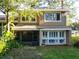 Charming home exterior featuring screened porch and shuttered windows at 6021 Windhover Dr # F11, Orlando, FL 32819