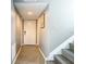 Hallway leading to stairs with neutral walls and tile flooring at 6021 Windhover Dr # F11, Orlando, FL 32819