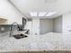 Kitchen features granite counters, stainless sink and faucet, and a gray backsplash at 6021 Windhover Dr # F11, Orlando, FL 32819