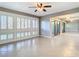 Living room with modern windows, tile flooring, ceiling fan and neutral paint at 6021 Windhover Dr # F11, Orlando, FL 32819