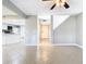 Wide-open living room featuring kitchen, entry door and tiled floors at 6021 Windhover Dr # F11, Orlando, FL 32819