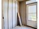Mud room includes a side door, a window and wood paneling at 6021 Windhover Dr # F11, Orlando, FL 32819