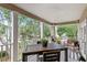 Charming covered balcony with outdoor seating offering a relaxing space to enjoy the neighborhood views at 6037 Caymus Loop, Windermere, FL 34786
