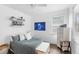 Bright bedroom with a comfortable bed, white dresser, and charming decorative elements, great natural light at 6037 Caymus Loop, Windermere, FL 34786