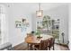 Dining area with a wood table and chairs, and a large window at 6037 Caymus Loop, Windermere, FL 34786