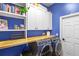 Efficient laundry room with a modern washer and dryer, butcher block countertops, and ample storage at 6037 Caymus Loop, Windermere, FL 34786