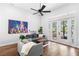 Cozy living room with French doors leading to an outdoor pool area at 6037 Caymus Loop, Windermere, FL 34786