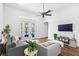 Comfortable living room with large windows and view of the pool at 6037 Caymus Loop, Windermere, FL 34786