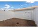 The backyard patio features brick pavers and white fencing for privacy at 6165 Juneberry Way, Winter Garden, FL 34787