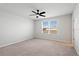 Spacious bedroom with ceiling fan and a sun-filled window at 6165 Juneberry Way, Winter Garden, FL 34787
