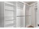 Walk-in closet with installed shelving and organization system at 6165 Juneberry Way, Winter Garden, FL 34787