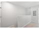 Upstairs hallway showcasing neutral carpet and fresh, neutral paint at 6165 Juneberry Way, Winter Garden, FL 34787