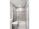 Bathroom featuring tiled shower with seamless glass doors at 6165 Juneberry Way, Winter Garden, FL 34787