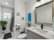 Well-lit bathroom with a large mirror, white countertops, and modern fixtures at 675 S Cedar Ave, Orange City, FL 32763