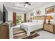 Relaxing bedroom with a sliding glass door to the backyard, neutral decor, and ceiling fan at 675 S Cedar Ave, Orange City, FL 32763
