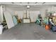 Spacious garage with epoxy flooring, ample storage space, and bright lighting at 675 S Cedar Ave, Orange City, FL 32763